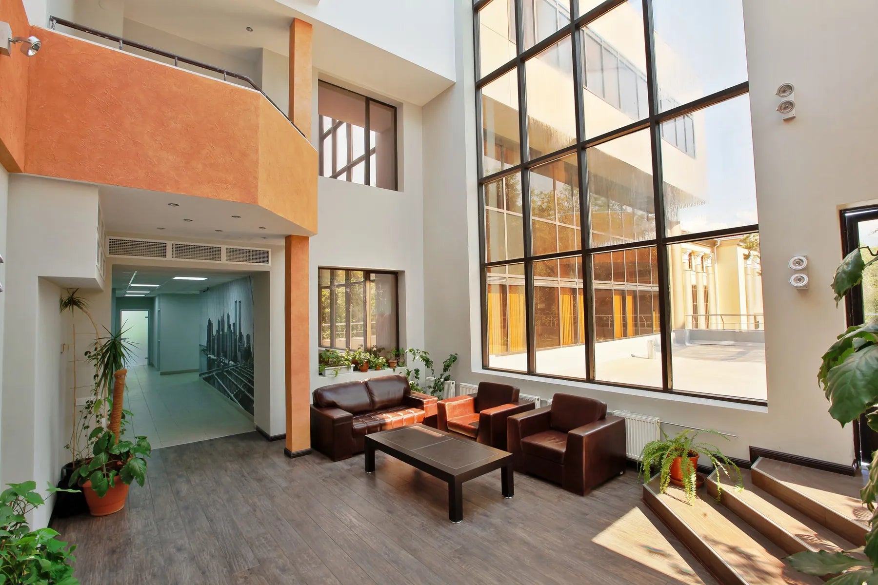 A modern office lobby with high ceilings and large windows